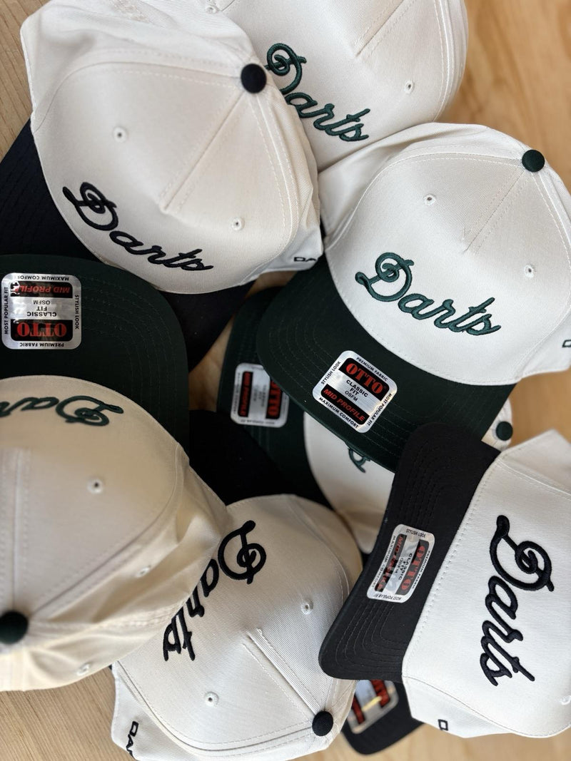 Darts — two-tone snapbacks, made by PAYRESPECTS