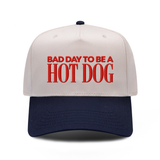 Bad Day To Be A Hot Dog embroidered hat in Navy / Natural, front view.
