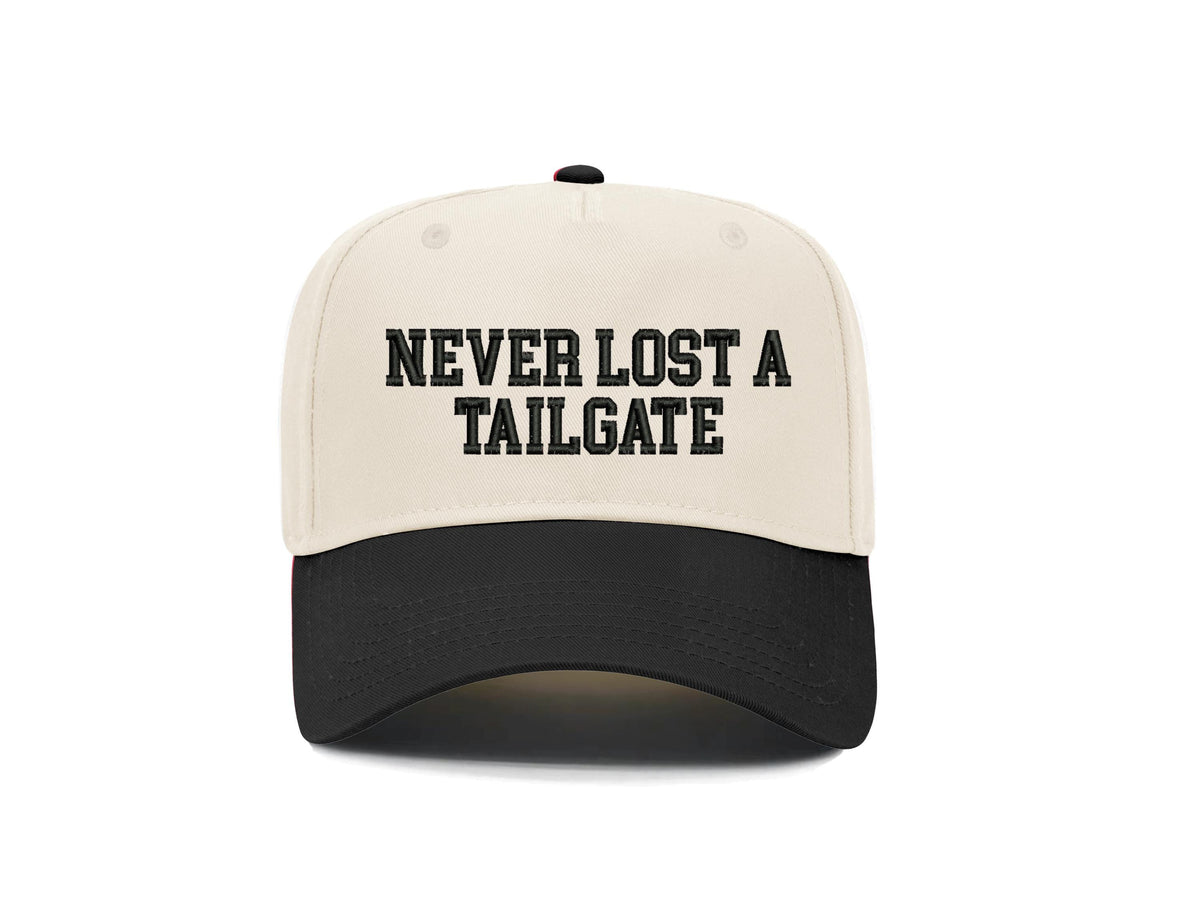 Never Lost a Tailgate embroidered snapback hat, natural front with black brim and black block lettering