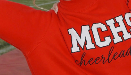 Custom team mockneck sweatshirt, chest lettering close-up