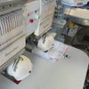 Video of an embroidery machine stitching snapback hats